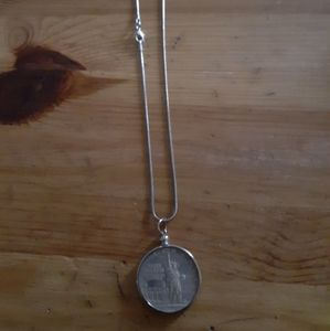 Silver chain with commercial. Silver dollar